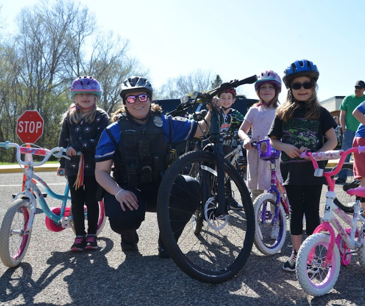  Students on bikes smile